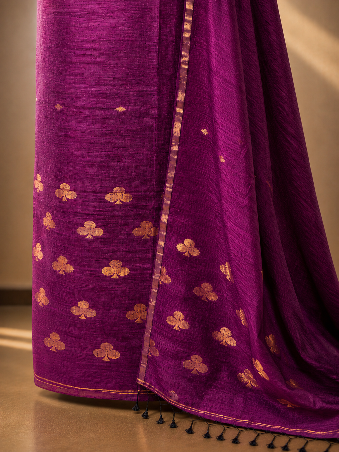 Close-up of handwoven Jamdani motifs on wine pure linen