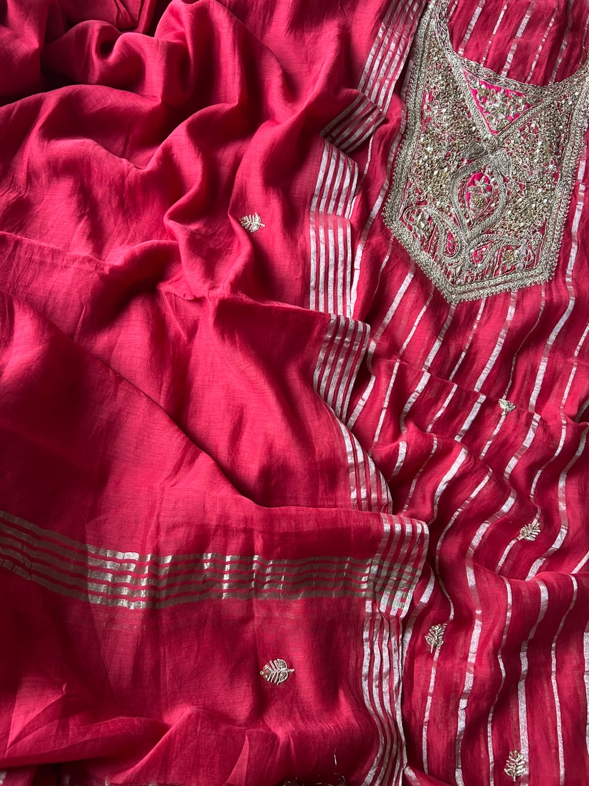 Close-up of silver zari and sequin yoke embroidery on fuchsia mul chanderi kurta with zari stripes