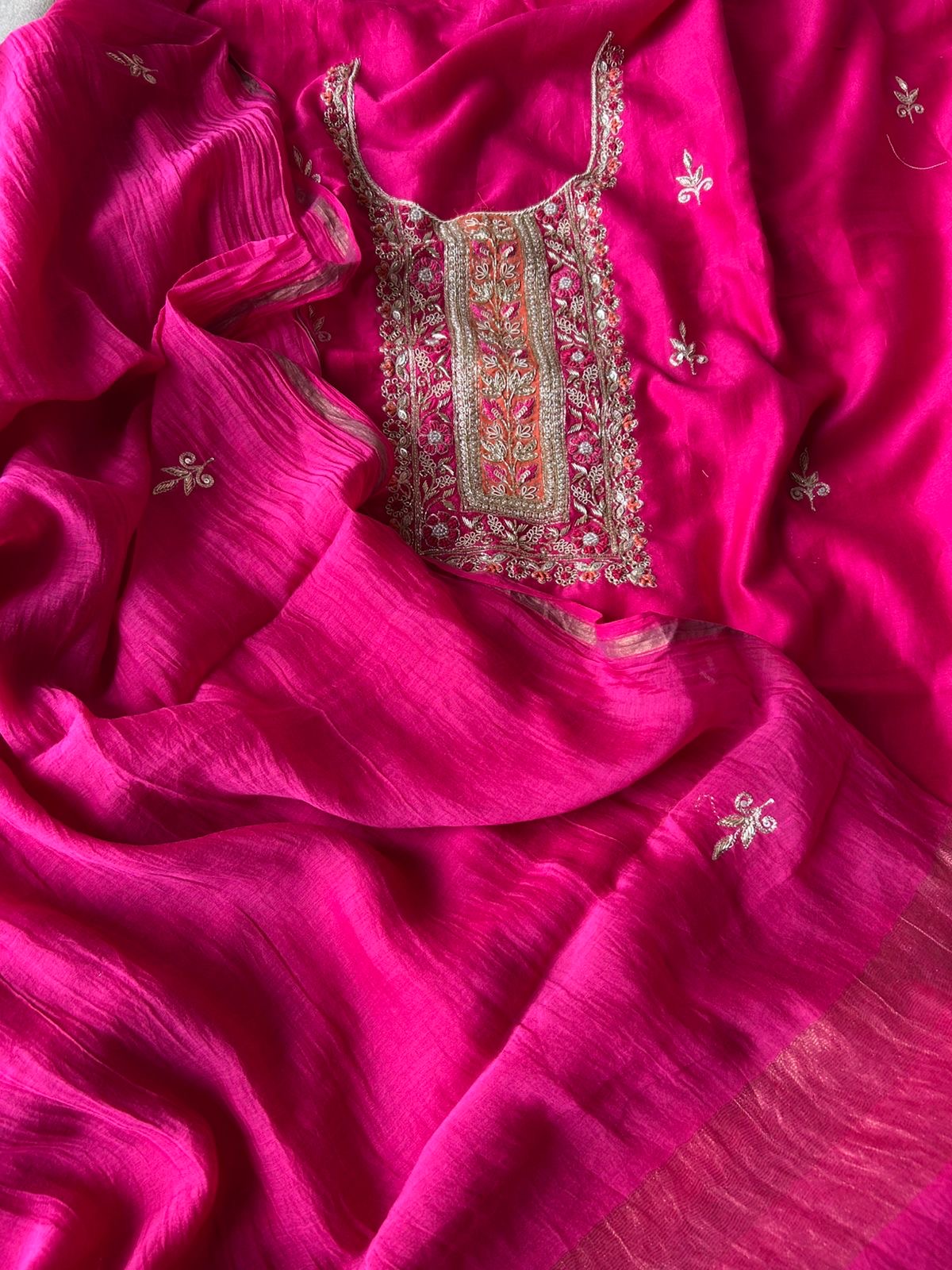 Close-up of zari and thread embroidered neckline panel on fuchsia mul chanderi kurta