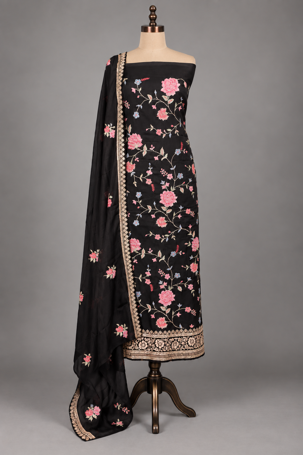Black twill suit set with pink and blue cross stitch florals and gold border dupatta