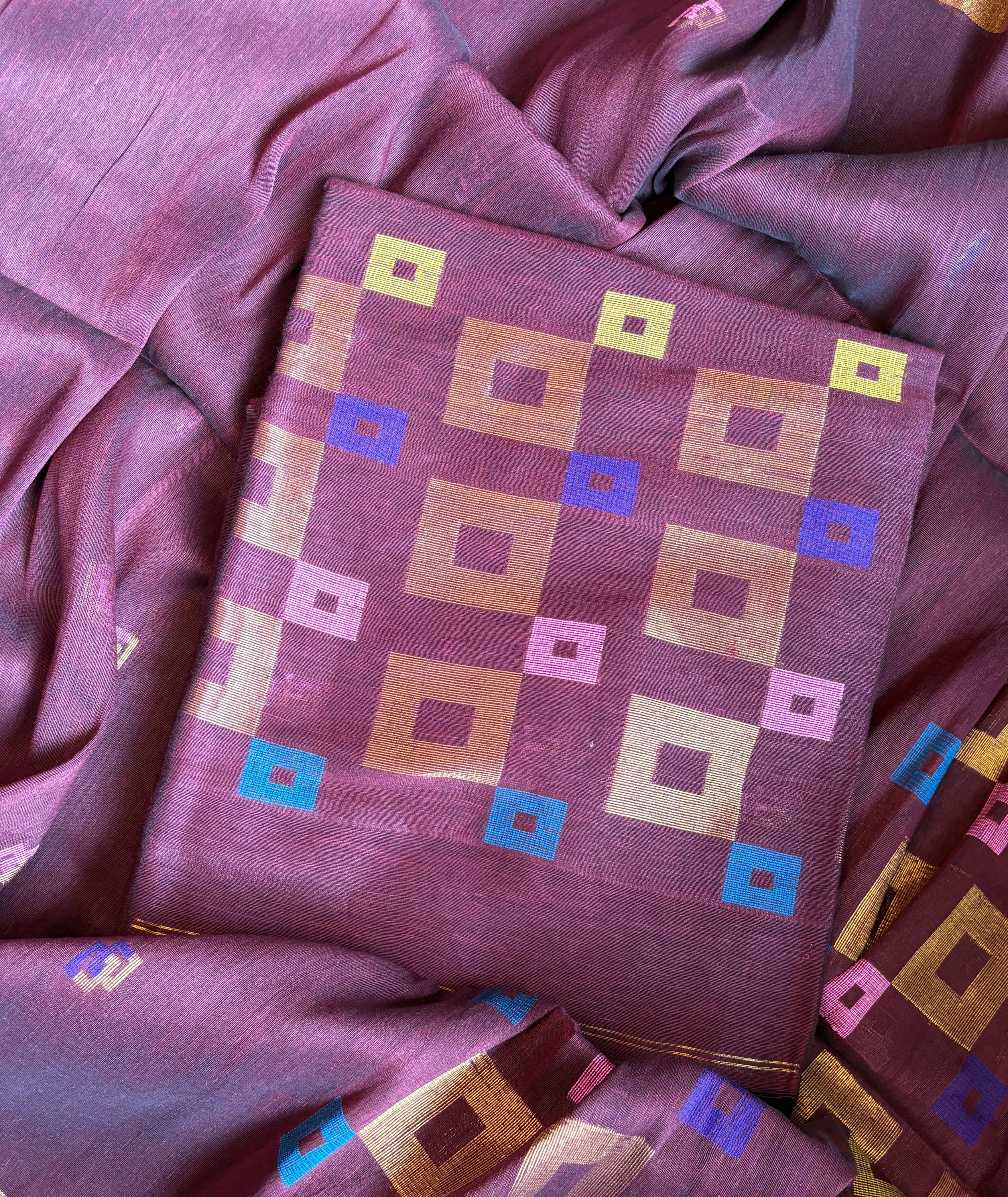 Deep burgundy pure linen Jamdani dupatta draped to show weave and texture