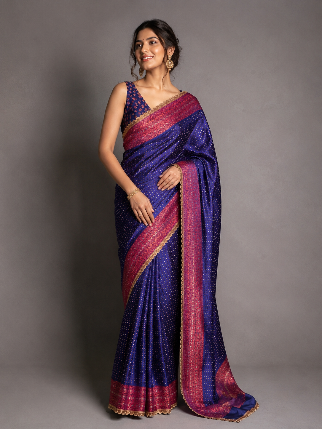 Royal blue saree with a contrasting rani pink zari border
