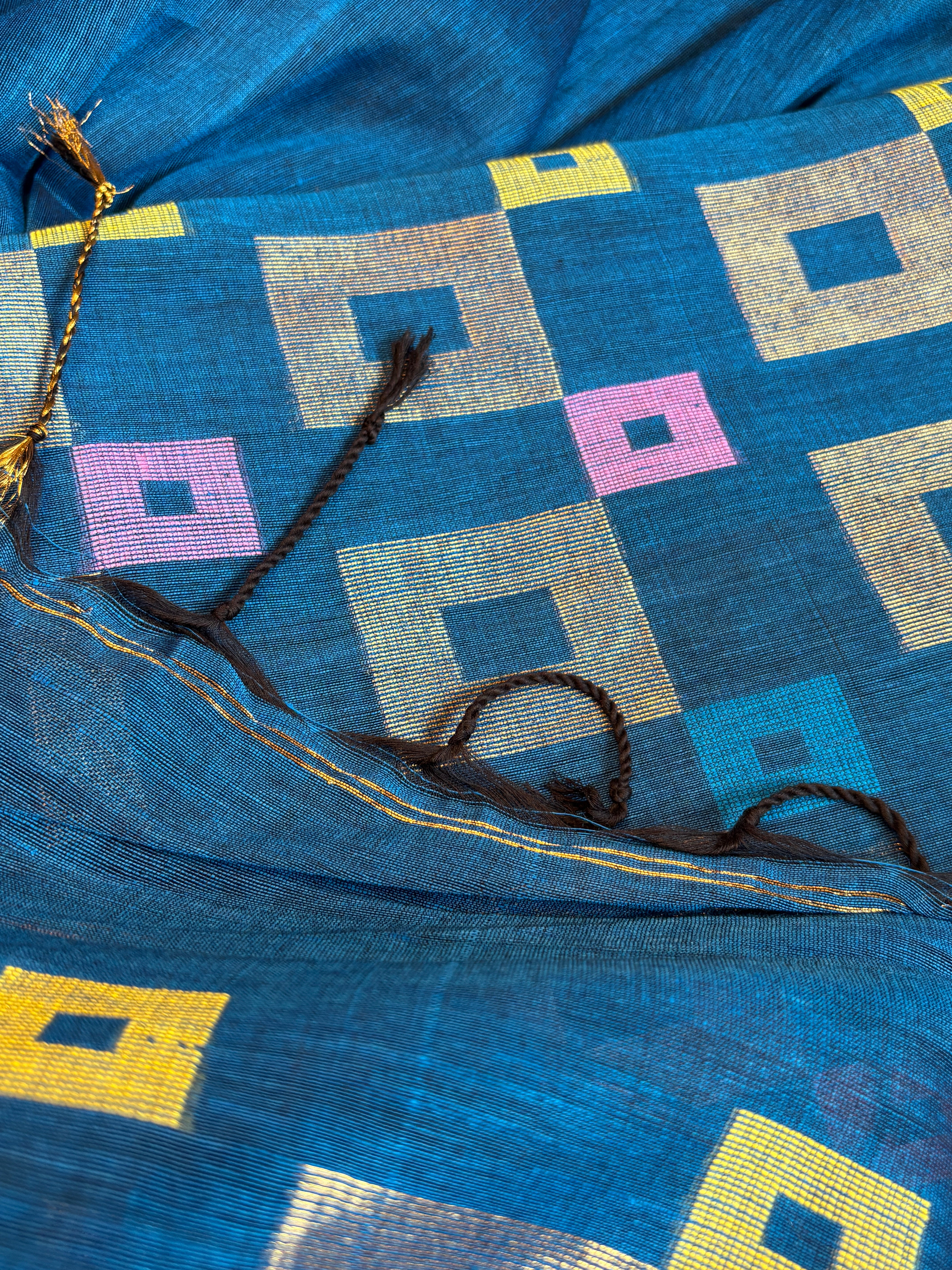 Peacock blue pure linen Jamdani dupatta draped to show weave and texture